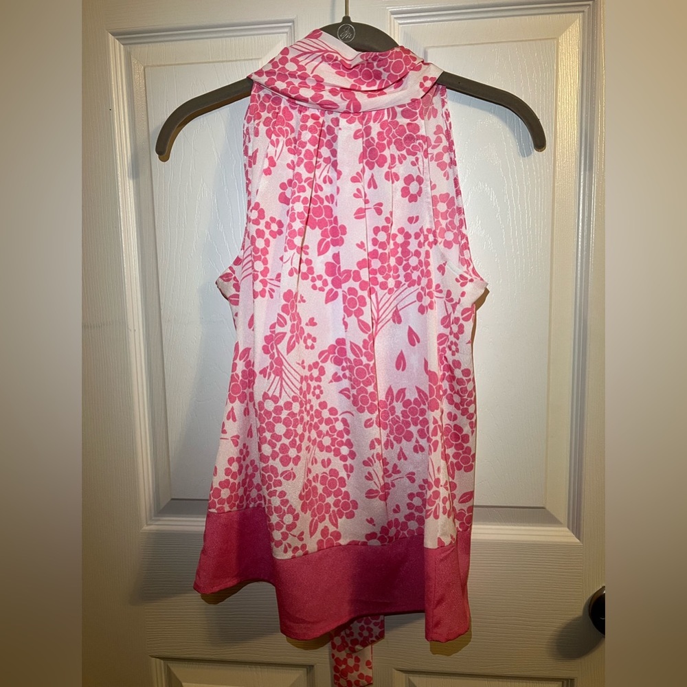 Pink and white floral patterned high neck sleeveless blouse
